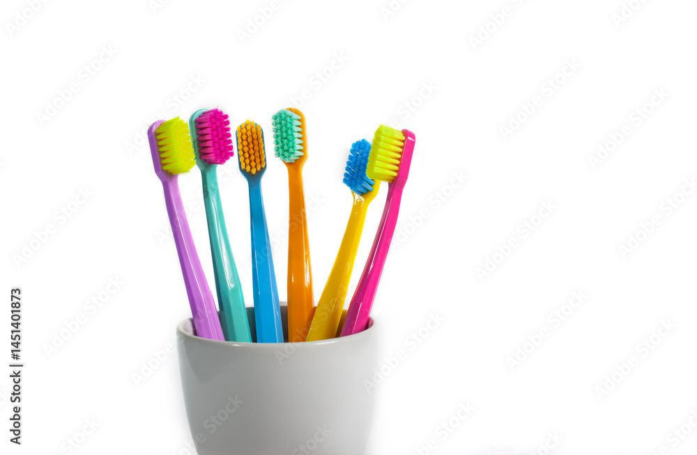 A set of multicolored toothbrushes isolated on white background. Design concept for dental and oral health theme.