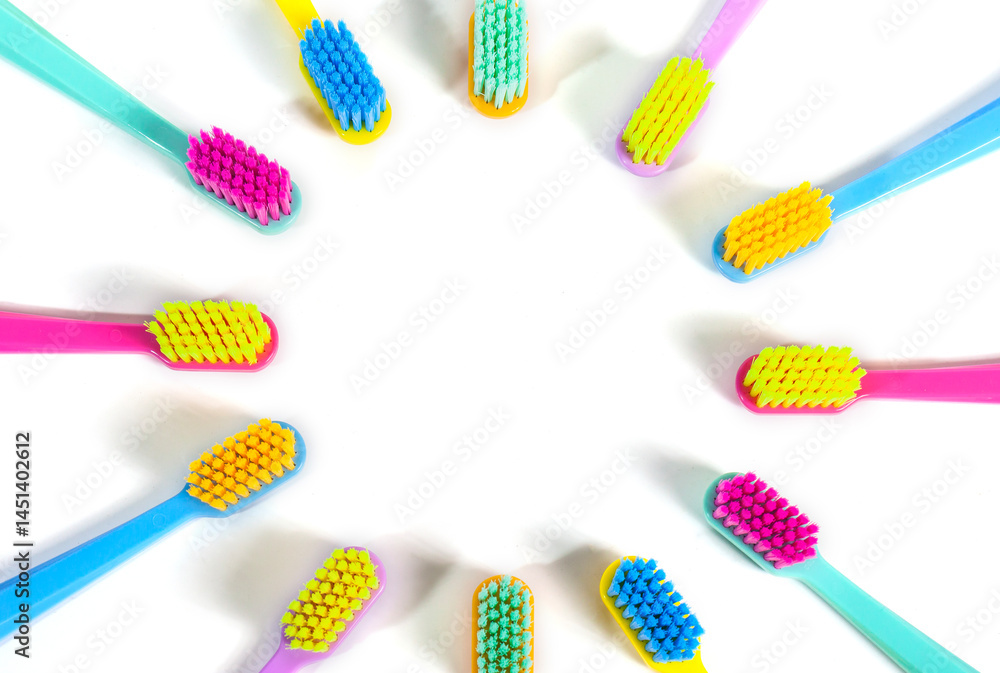 A set of multicolored toothbrushes isolated on white background. Design concept for dental and oral health theme.