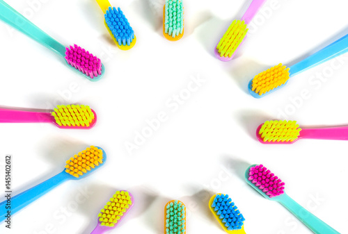 A set of multicolored toothbrushes isolated on white background. Design concept for dental and oral health theme.