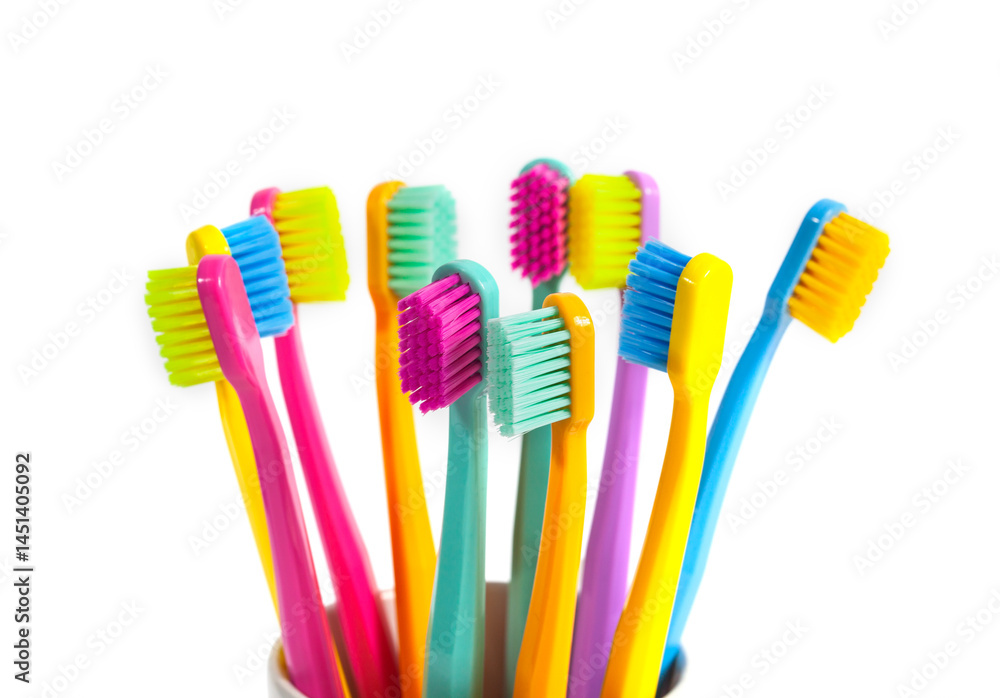 A set of multicolored toothbrushes isolated on white background. Design concept for dental and oral health theme. A set of multicolored toothbrushes isolated on white background. Design concept for dental and oral health theme.