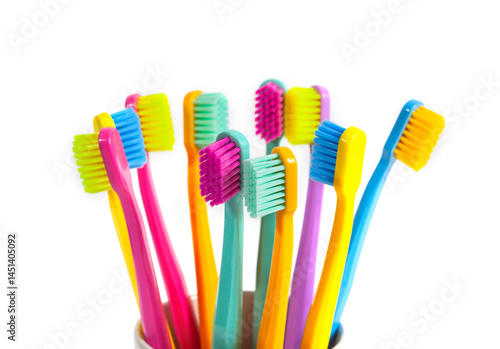 A set of multicolored toothbrushes isolated on white background. Design concept for dental and oral health theme.