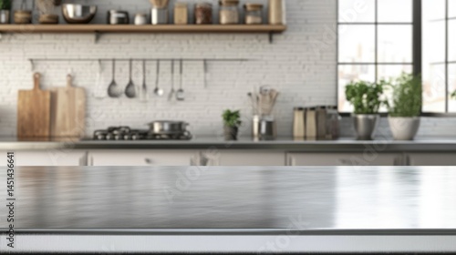 Empty stainless tabletop with blurred kitchen view background.