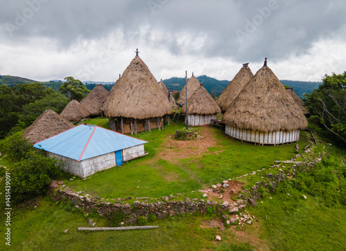 Obraz na płótnie Aerial view of a complex of traditional houses in one of the villages in the Aileu Municipality in Timor Leste located in a hilly area. Still actively inhabited by locals and a tourist attraction. w salonie