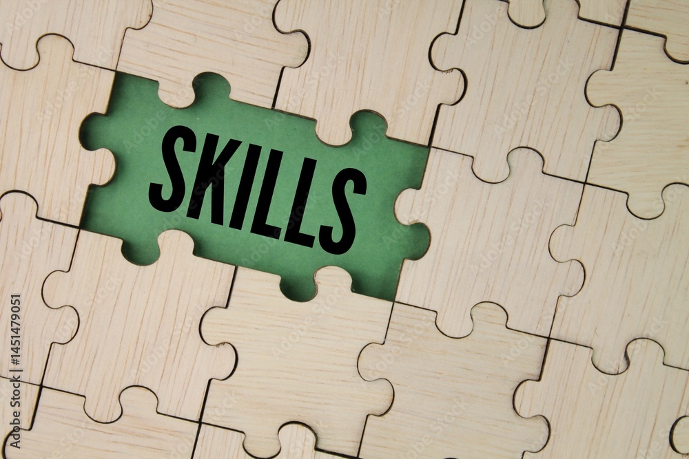 wooden puzzle with the word skills. skill concept. the ability to do something well. wooden puzzle with the word skills. skill concept. the ability to do something well.