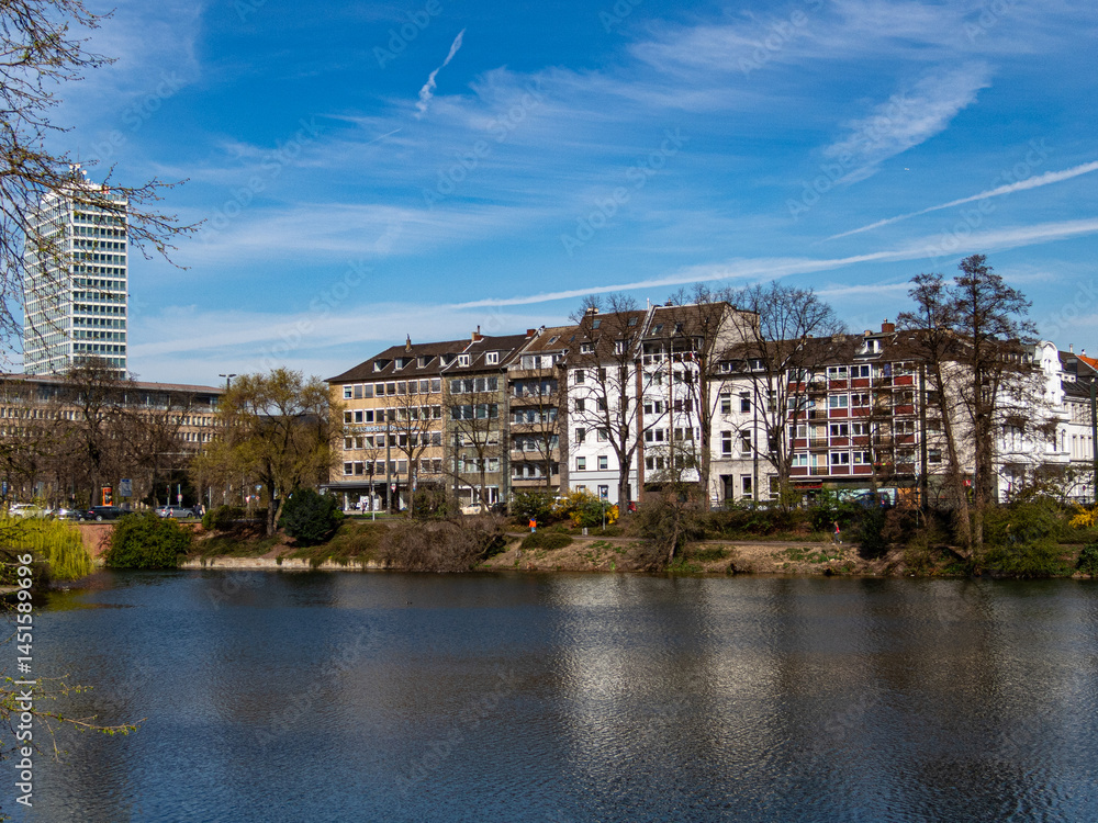 View to a lake and trees in the city