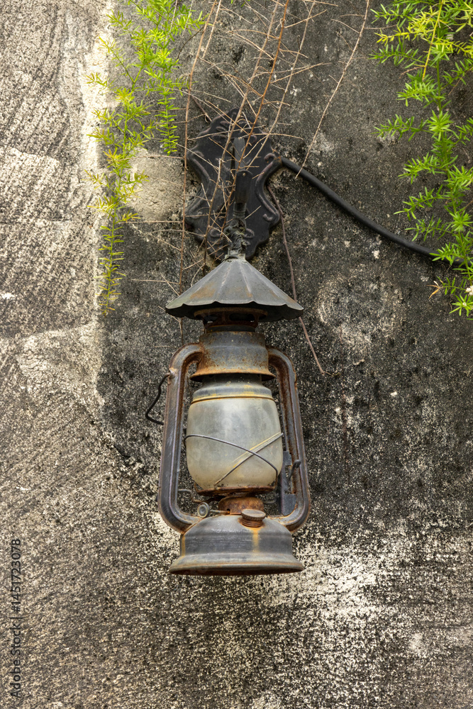 Old lamp hanging on a wall