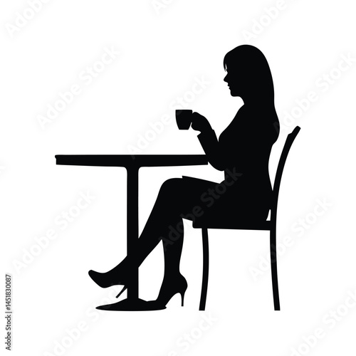 Silhouette of a woman sitting at a table enjoying a cup of coffee