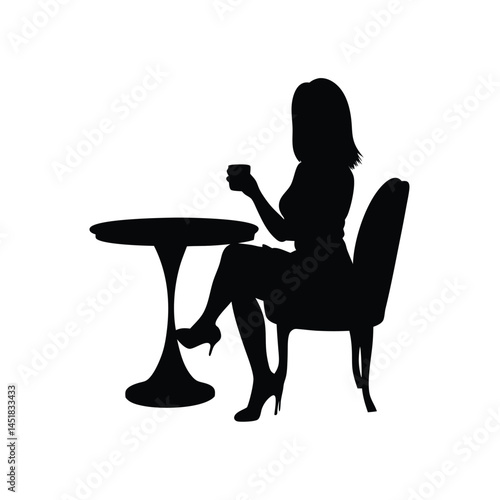 Silhouette of a woman sitting at a table enjoying a cup of coffee