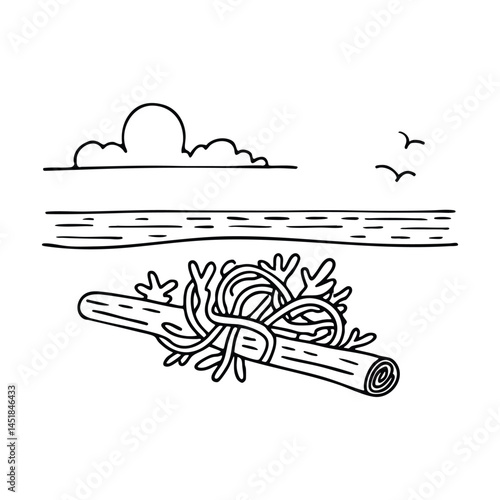 A clump of seaweed tangled around a piece of driftwood at beach