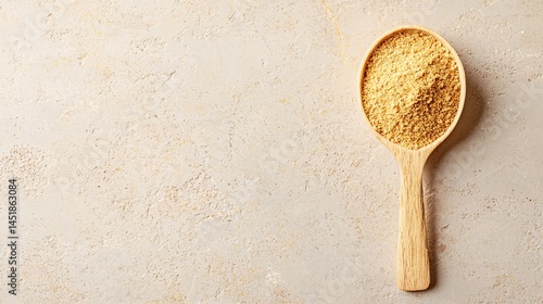 view of cricket powder in a wooden spoon placed on a textured stone surface with empty space for text cricket powder protein supplement superfood insect-based nutrition eco food sustainable 