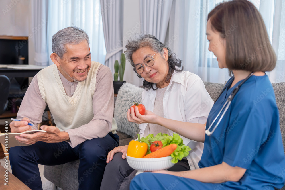 home health care nurse in uniform explaining nutritional value of fruits,vitamins and dietary fiber to senior couple,old man writing on notebook home health care nurse in uniform explaining nutritional value of fruits,vitamins and dietary fiber to senior couple,old man writing on notebook