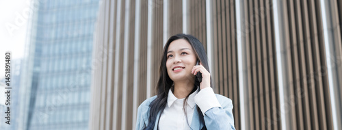 Asian woman talking on mobile phone