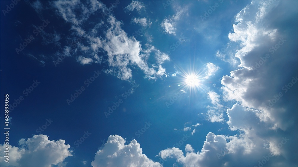 Bright Sun Shining in a Radiant Blue Sky with Scattered Clouds