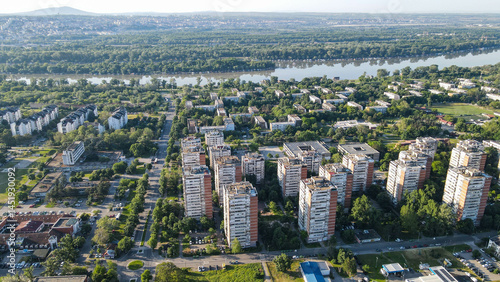 Wallpaper Mural Aerial sunrise view of residential district in New Belgrade, Serbia. Brutalist socialist-era apartment blocks 44 and 45 glowing in warm morning light, Eastern Europe housing. Torontodigital.ca