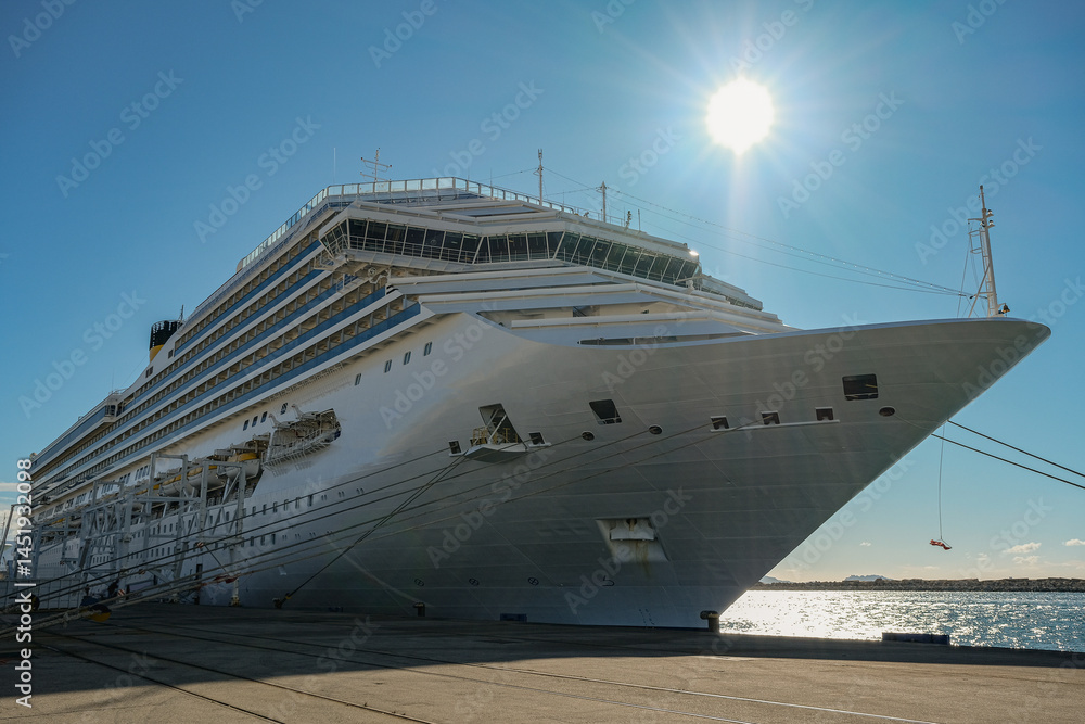 Mega family cruiseship cruise ship liner Fortuna docked at terminal in Marseille Provence, France during breathtaking sunset sunrise twilight blue hour dusk dawn silhouette scenic panorama