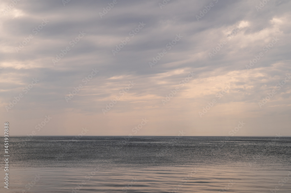 Ocean with sky in horizon. Calm sea in evening. Seascape at sunset.