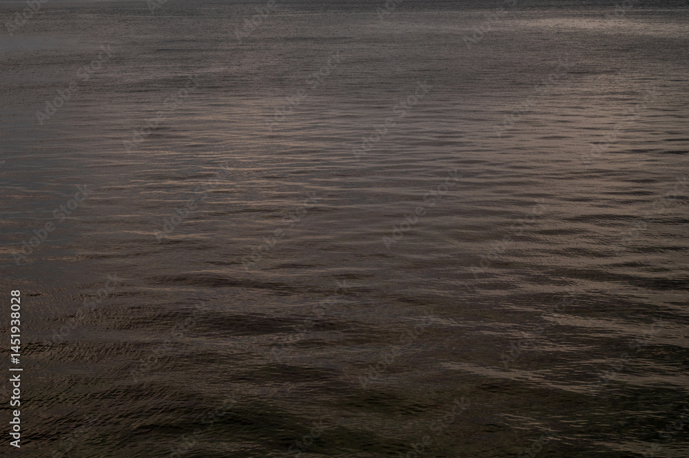 Water sea sunset. Sun reflection ocean waves. Nature golden abstract texture surface.