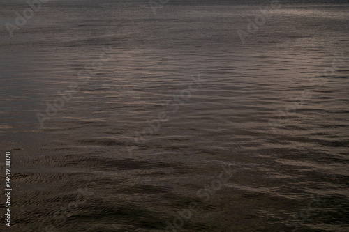 Obraz na płótnie Water sea sunset. Sun reflection ocean waves. Nature golden abstract texture surface. w salonie