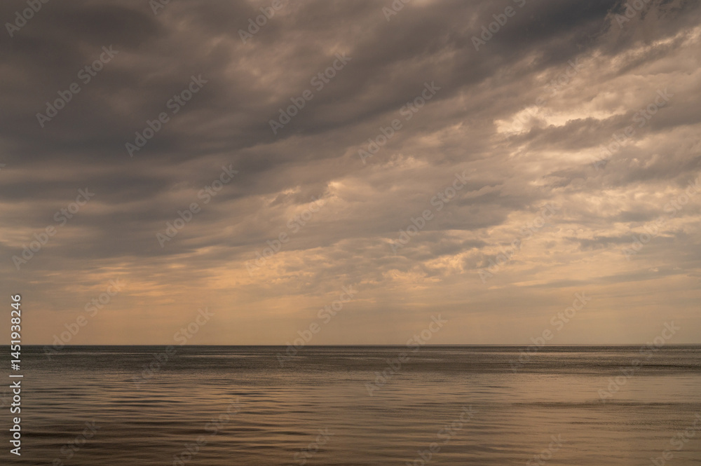 Ocean with sky in horizon. Calm sea in evening. Seascape at sunset.