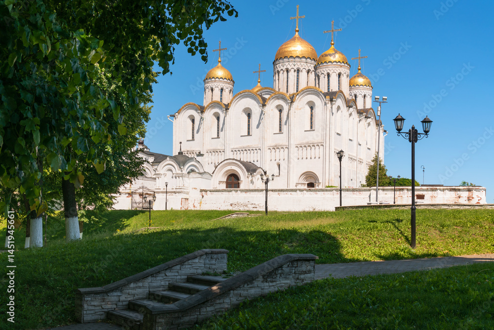 The Cathedral Assumption of the Blessed Virgin Mary (Assumption Cathedral) monument of white stone architecture of Ancient Russia on a sunny summer day, Vladimir, Russia The Cathedral Assumption of the Blessed Virgin Mary (Assumption Cathedral) monument of white stone architecture of Ancient Russia on a sunny summer day, Vladimir, Russia
