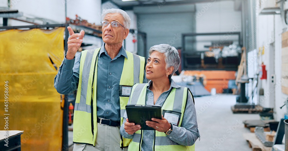 People, engineer and explain with tablet at factory for planning, supply chain and inventory management. Mature staff, team and digital for manufacturing, logistics feedback and production checklist People, engineer and explain with tablet at factory for planning, supply chain and inventory management. Mature staff, team and digital for manufacturing, logistics feedback and production checklist