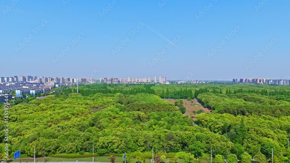 4K real time aerial view of modern buildings and Forest Park in the suburbs on sunny day, Fengxian District, Shanghai, China. 4K real time aerial view of modern buildings and Forest Park in the suburbs on sunny day, Fengxian District, Shanghai, China.