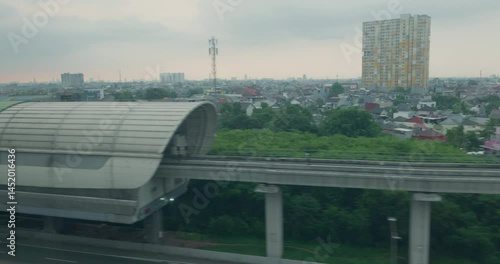 Wallpaper Mural Window view of Jakarta Bandung high speed train passing through the suburb area Torontodigital.ca