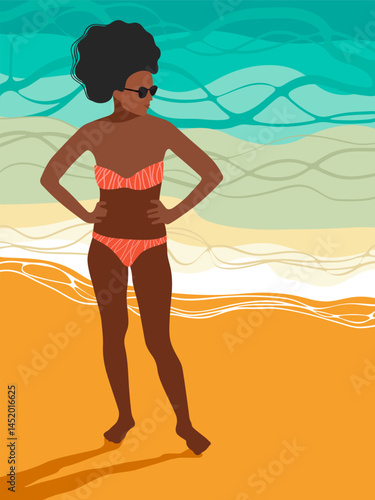 Dark skinned beautiful woman in bikini relaxing on a beach
