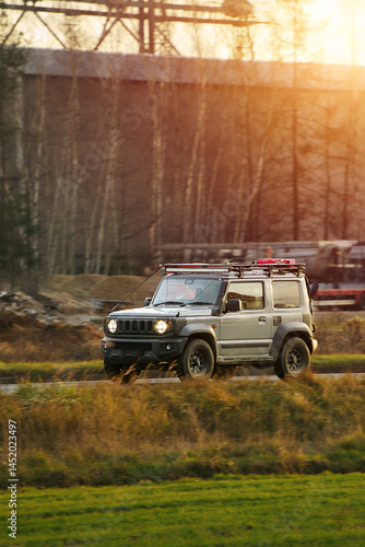 Obraz na płótnie Grey SUV with roof rack in countryside w salonie