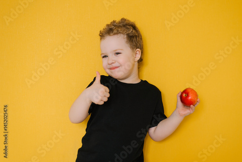 Boy Giving A Thumbs Up Holding An Apple