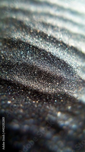 Close-up view showcasing the intricate texture and grainy surface of fine sandpaper, revealing unique patterns and details