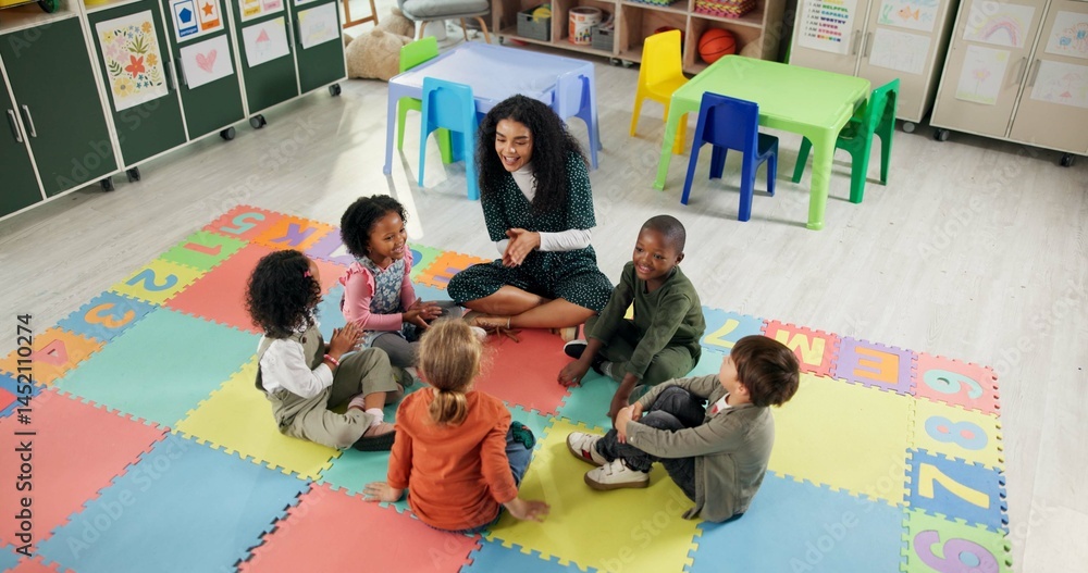 Singing, learning and teacher with children in classroom for education growth, nursery rhyme or creative. Above, kindergarten or academy with woman and kids at school for helping or child development