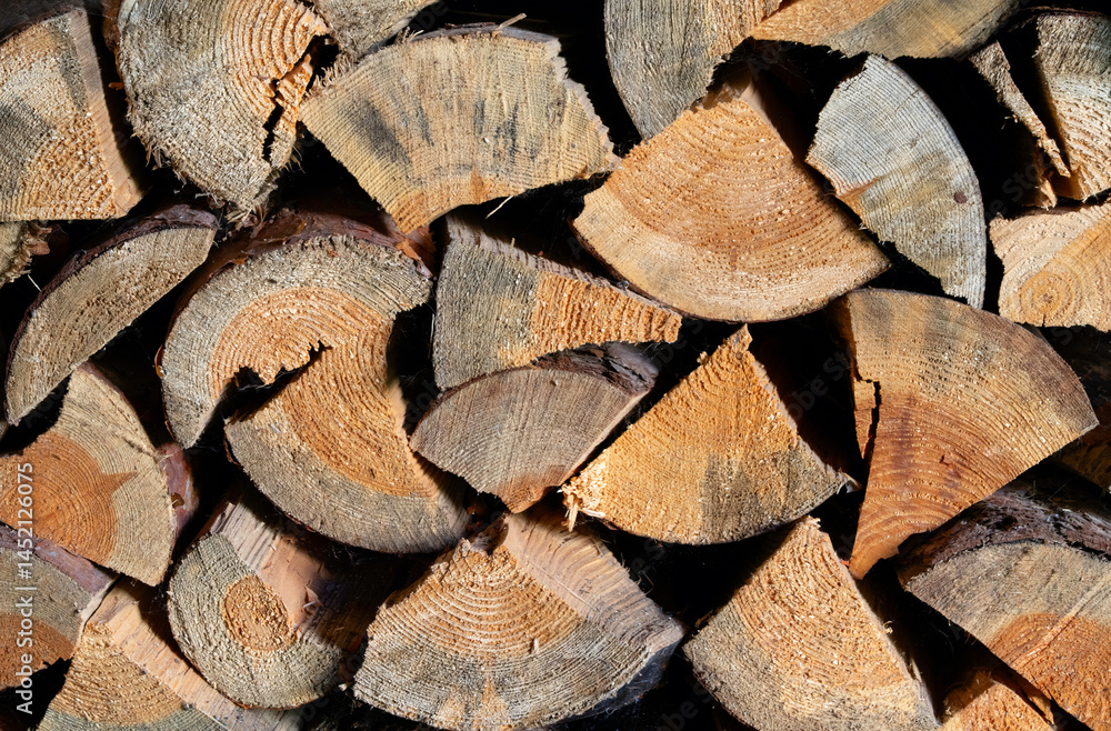Fototapeta premium Background of chopped firewood closeup
