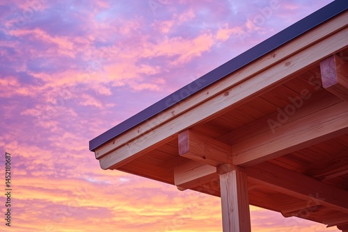 Wooden roof overhang at sunset.