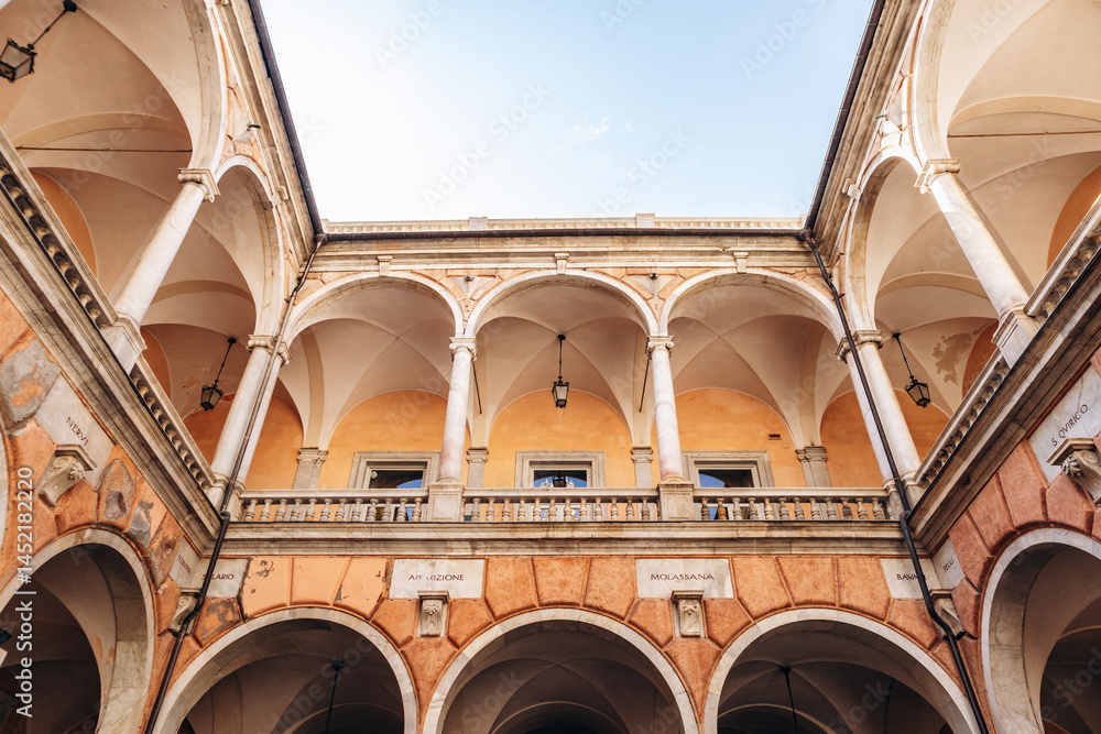 Fototapeta premium Elegant Renaissance courtyard with marble columns and vaulted arches inside Palazzo Doria-Tursi on Via Garibaldi.