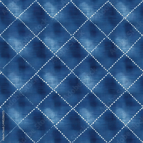 Seamless blue pattern with diamond shapes and dotted lines creating textured effect. Ideal for fabric or wallpaper design