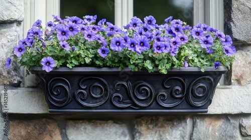 Ornate planter box overflowing with vibrant purple flowers