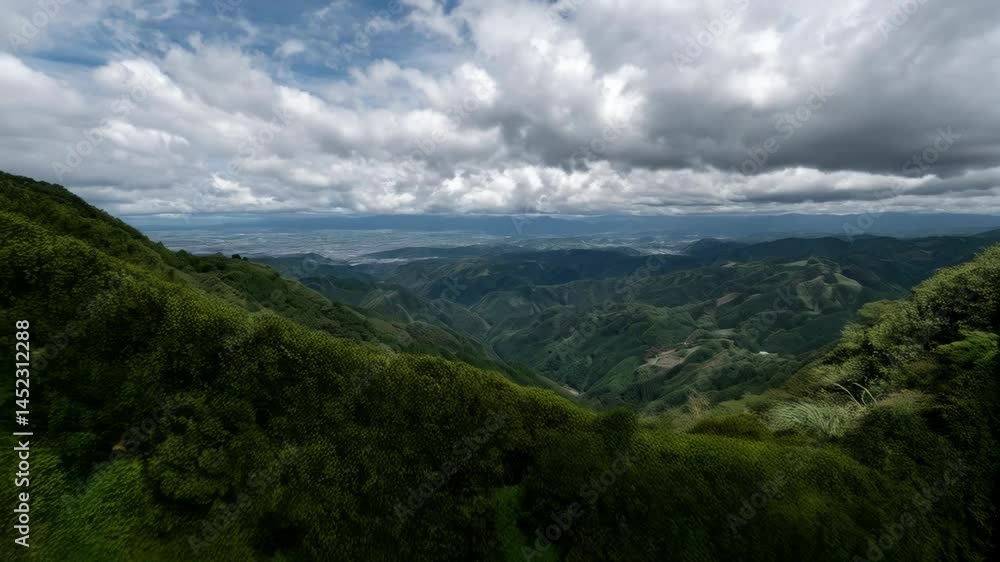 Scenic Vista of Rolling Green Mountains Under Overcast Skies, Aerial View of Dense Forests and Distant Urban Area, Natural Landscape Scenic Vista of Rolling Green Mountains Under Overcast Skies, Aerial View of Dense Forests and Distant Urban Area, Natural Landscape