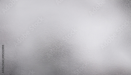 Close-up of a shiny silver foil texture with reflective properties and metallic sheen