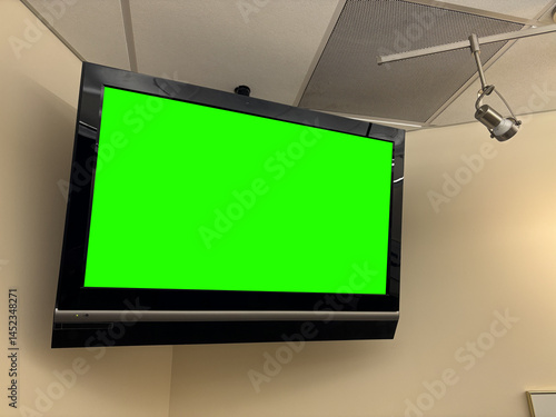 A Green Screen Wall Mounted Television in Modern Hospital Waiting Room