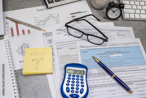 Text Need help on sticker Annual tax polish tax forms PIT-36 PIT-37 PIT-38 with pen calculator.