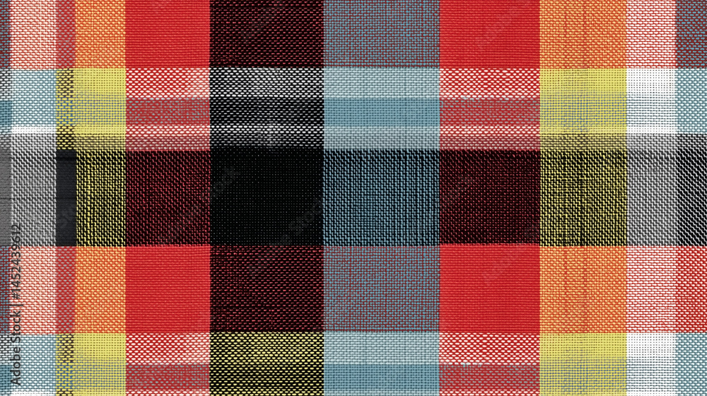 A checkered patterned fabric with red, yellow, and blue colors A checkered patterned fabric with red, yellow, and blue colors