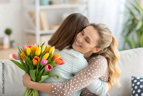 Happy Reunion with Flowers – Emotional Hug Between Friends.