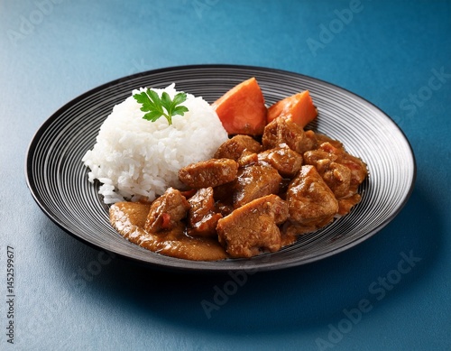 a plate of food with meat and rice