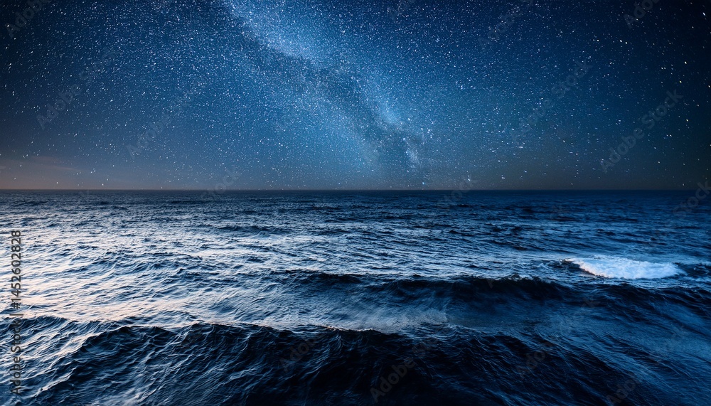 Fototapeta premium dark ocean waves under starry night sky with calm water surface