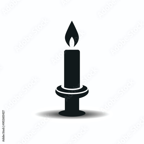 A yellow wax candle with a bright flame burns atop a decorative candlestick, a classic symbol of light and warmth.