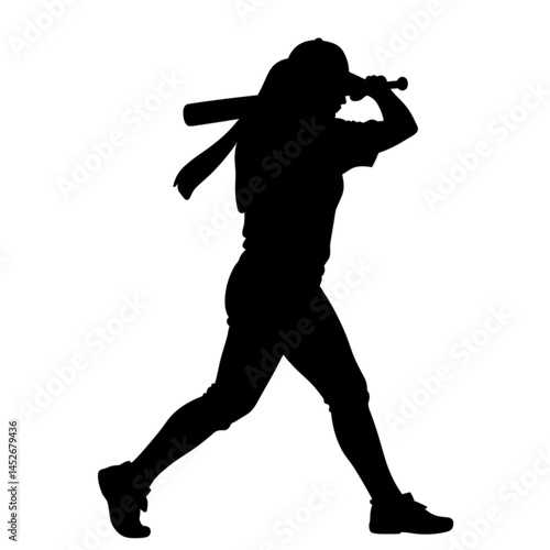 Female baseball player swinging bat in silhouette  