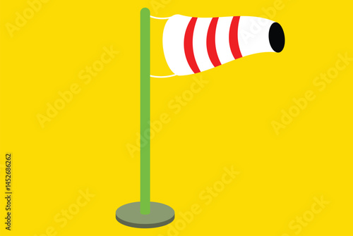 Wind sock on green pole, yellow background
