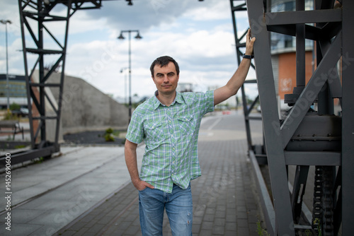 Obraz na płótnie Portrait of handsome man outdoors in industrial area w salonie