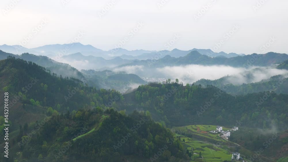Experience the breathtaking timelapse of a mountain village in southern Anhui Province amidst clouds and mist Experience the breathtaking timelapse of a mountain village in southern Anhui Province amidst clouds and mist